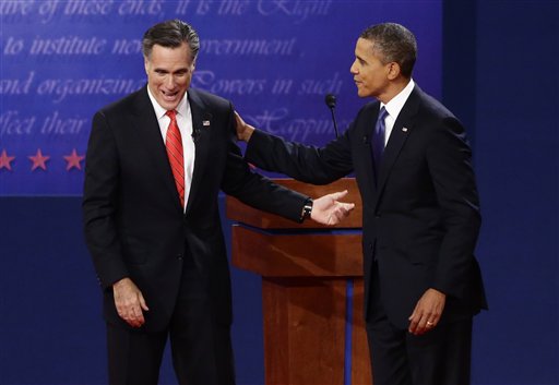 President Barack Obama and former Massachusetts Gov. Mitt Romney talk at the end of the first presidential debate in Denver on Wednesday.
