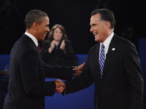 Moderator Candy Crowley, center, applauds as President Barack Obama, right, shakes hands with Republican presidential nominee Mitt Romney Tuesday during the second presidential debate at Hofstra University in Hempstead, N.Y.