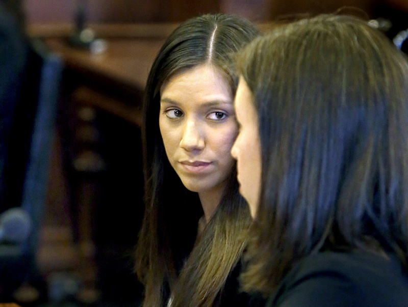 Alexis Wright, left, listens to her lawyer Sarah Churchill during Wright's arraignment Tuesday at the Cumberland County Courthouse in Portland.