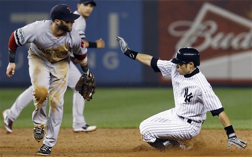 Boston Red Sox second baseman Dustin Pedroia, left, cannot make the tag as New York Yankees' Ichiro Suzuki is safe stealing during the sixth inning of their baseball game at Yankee Stadium in New York, Wednesday, Oct. 3, 2012. (AP Photo/Kathy Willens)