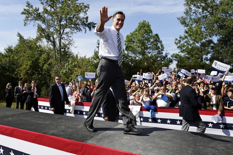 Republican presidential candidate, former Massachusetts Gov. Mitt Romney waves as he arrives for a campaign stop at Tidewater Community College in Chesapeake, Va., Wednesday, Oct. 17, 2012. (AP Photo/Charles Dharapak)