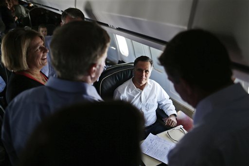 Republican presidential candidate Mitt Romney talks with senior advisers on his campaign plane en route to Denver recently.