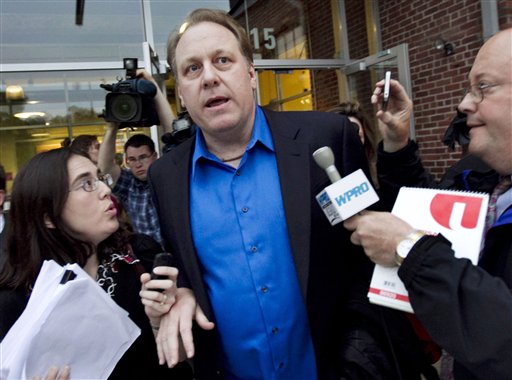 Former Boston Red Sox pitcher Curt Schilling departs the Rhode Island Economic Development Corporation headquarters in Providence, R.I., in this May 21, 2012, photo.