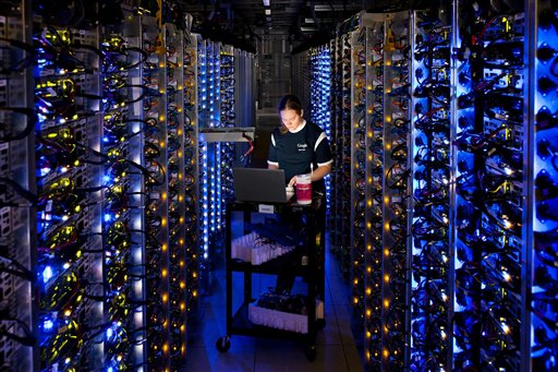 An undated photo provided by Google shows a Google technician working on some of the computers in the Dalles, Ore., data center.