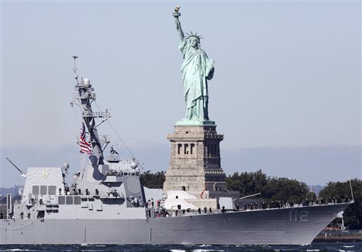 The USS Michael Murphy powers past the Statue of Liberty as it heads into New York Harbor on Monday in New York.