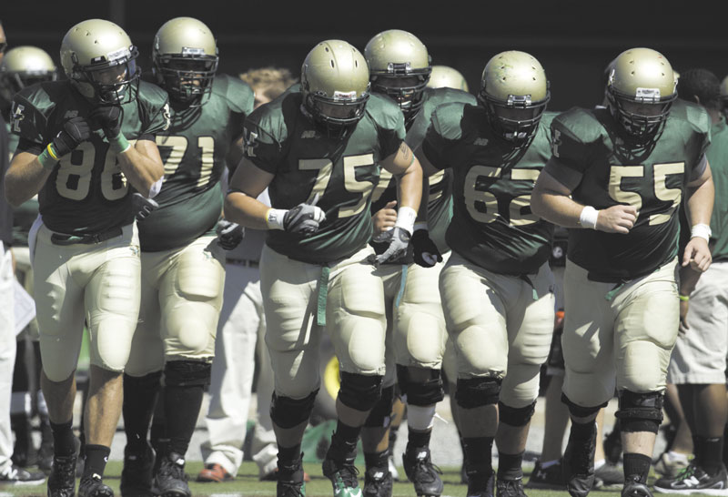 LEADING THE WAY: Messalonskee High School graduate Cody Ziegenfus (75) is one of two returning players on the offensive line at Husson University. Ziegenfus, a junior tackle, has taken on a leadership role this season because of the team’s lack of upperclassmen.