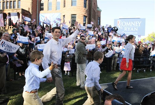 Republican vice presidential candidate Paul Ryan waves to the crowd with some of his children in tow, at the Clinton County courthouse in Clinton, Iowa, Tuesday, Oct. 2, 2012. (AP Photo/The Quad City Times, Kevin E. Schmidt)