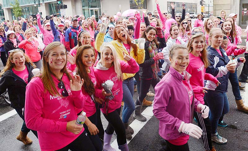 A large crowd of participants take off down Congress Street in Portland as they begin the 2012 Making Strides Against Breast Cancer Walk on Sunday.