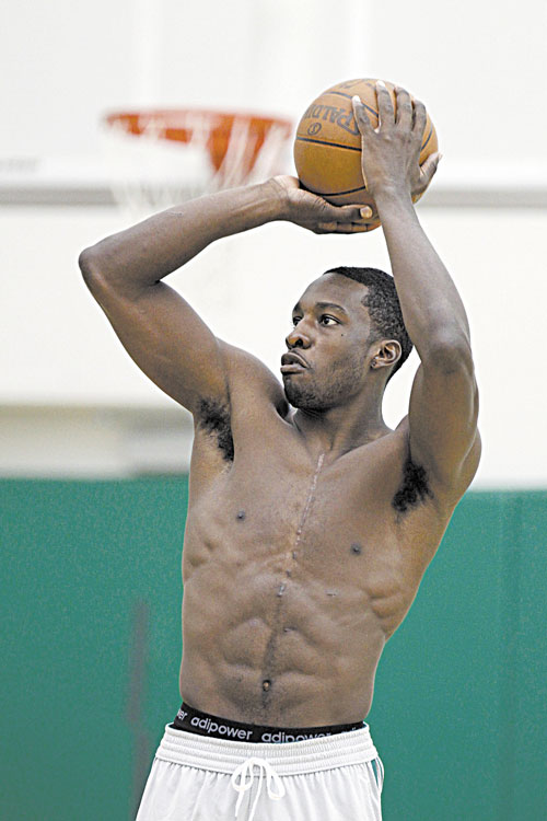 BACK IN ACTION: Boston’s Jeff Green shoots during practice Saturday at the team’s training facility in Waltham, Mass. After missing all of last season after undergoing heart surgery.