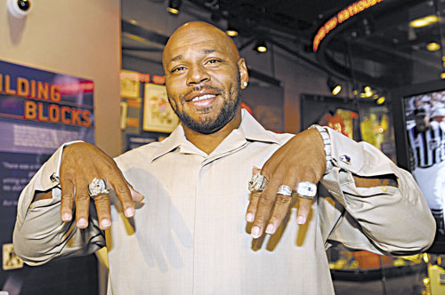 3-TIME CHAMP: New England Patriots running back Kevin Faulk shows off his three Super Bowl rings and a divisional championship ring at a news conference where he announced his retirement Tuesday in Foxborough, Mass. In his 13 seasons with the Patriots, Faulk rushed for 3,607 yards and 16 touchdowns and caught 431 passes for 3,701 yards and 15 touchdowns.