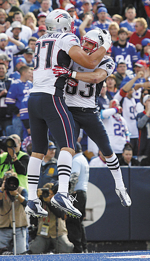 TIME TO CELEBRATE: New England’s Rob Gronkowski (87) celebrates his touchdown against Buffalo with Wes Welker on Sunday in Orchard Park, N.Y.
