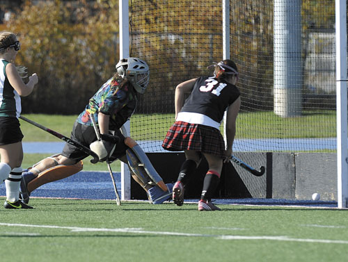 IT’S GOOD: Lisbon High School’s Arianna Kahler (31) follows her shot as Winthrop goalie Alyssa Arsenault tries to make the stop in the first half of the Class C state championship game Saturday in Orono.
