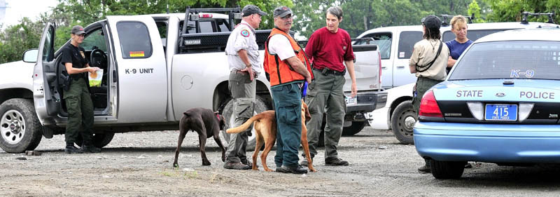File photo by David Leaming Members of Maine Search and Rescue Dogs assemble at the Pan Am railroad yard in Waterville after searching the area for evidence of missing toddler Ayla Reynolds, in this file photo from July 17.