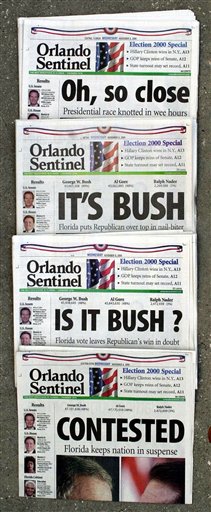 FILE - This Nov. 8, 2000 file photo shows Orlando Sentinel election night headlines The first headline was, "Oh, so close," followed by "IT'S BUSH," then "IS IT BUSH?" and lastly "CONTESTED." The presidential election is still undecided while the nation waits for Florida's final vote count. The mere mention of the 2000 election unsettles people in Palm Beach County. The county�s poorly designed �butterfly ballot� confused thousands of voters, arguably costing Democrat Al Gore the state, and thereby the presidency. Gore won the national popular vote by more than a half-million ballots. But George W. Bush became president after the Supreme Court decided, 5-4, to halt further Florida recounts, more than a month after Election Day. Bush carried the state by 537 votes, enough for an Electoral College edge, and the White House. (AP Photo/Peter Cosgrove, File)