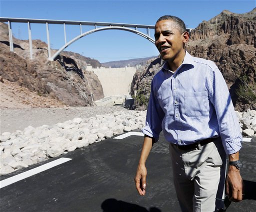 President Barack Obama stands at the heliport overlooking the Hoover Dam, Tuesday, Oct. 2, 2012 in Boulder City, Nev. (AP Photo/Pablo Martinez Monsivais)