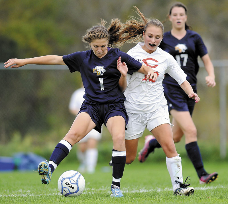 Foot race: Mount Blue High School’s Eryn Doiron (1) attempts to drive the ball away from Cony High School’s Olivia Deeves as Mt. Blue’s Miranda Nicely (17) closes in during a soccer game Tuesday in Augusta.