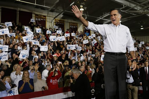 Republican presidential candidate, former Massachusetts Gov. Mitt Romney waves to supporters as he takes the stage at a campaign stop at Avon Lake High School in Avon Lake, Ohio, on Monday.