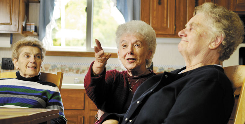 Staff photo by Andy Molloy MEMORY LANE: Sisters Christine Dupuis, right, Lorraine Danforth and Edna Doyon recalled growing up in Augusta in the 1950s during an interview in Belgrade.