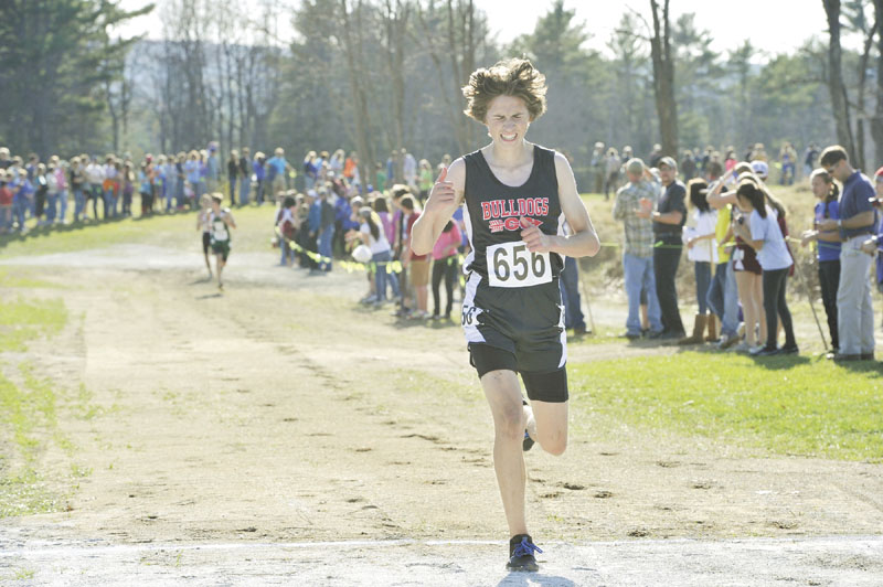 LEADING THE WAY: Hall Dale’s Josh Ringer finished eight in a time of 17 minutes, 34.80 seconds to lead the Bulldogs to the Class C cross country state championship Saturday in Belfast.