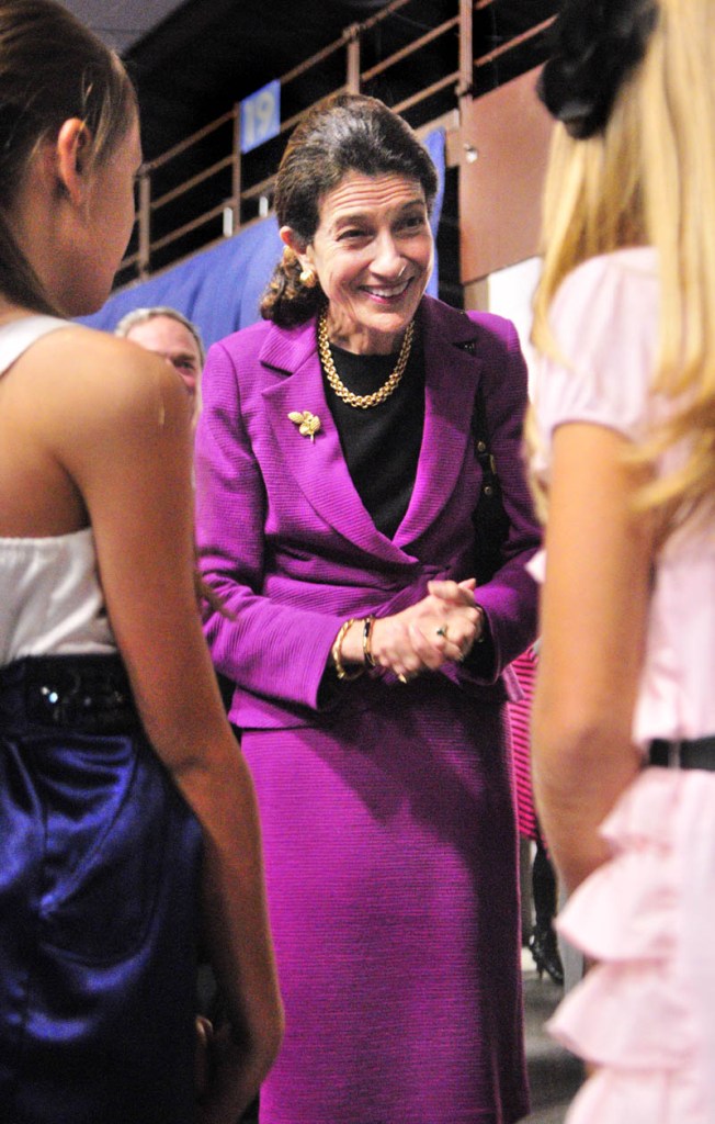 US Senator Olympia Snowe, center, greets Mia-Angelina Leslie, left, 10 and her sister Maddy Leslie, 12 both of Lewiston, on Friday evening at the start of the Maine State Chamber of Commerce Awards at the Augusta Civic Center. Maddy Leslie sang the National Anthem as part of the opening ceremonies.