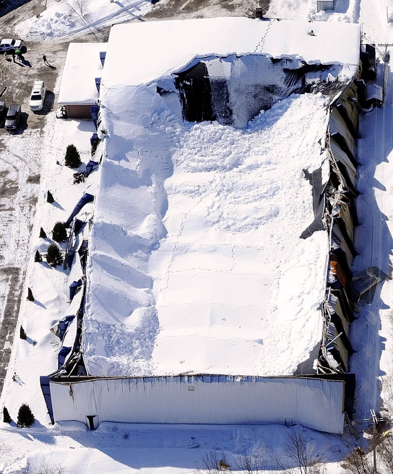 This aerial photo taken Thursday shows the collapsed roof of the Kennebec Ice Arena in Hallowell. No one was injured when the roof fell onto the rink on Wednesday afternoon.