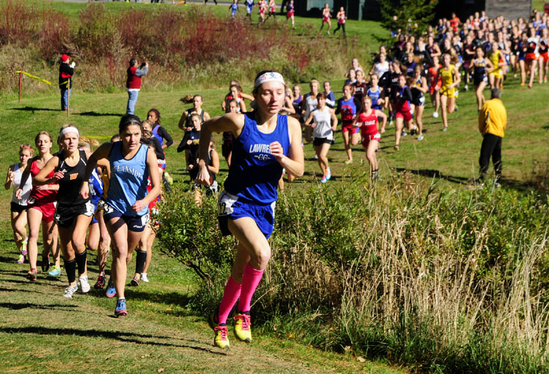 Staff photo by Joe Phelan Lawrence's Erzsebet Nagy runs in fourth place early in the race during KVAC cross country meet on Saturday morning at Cony High School in Augusta.