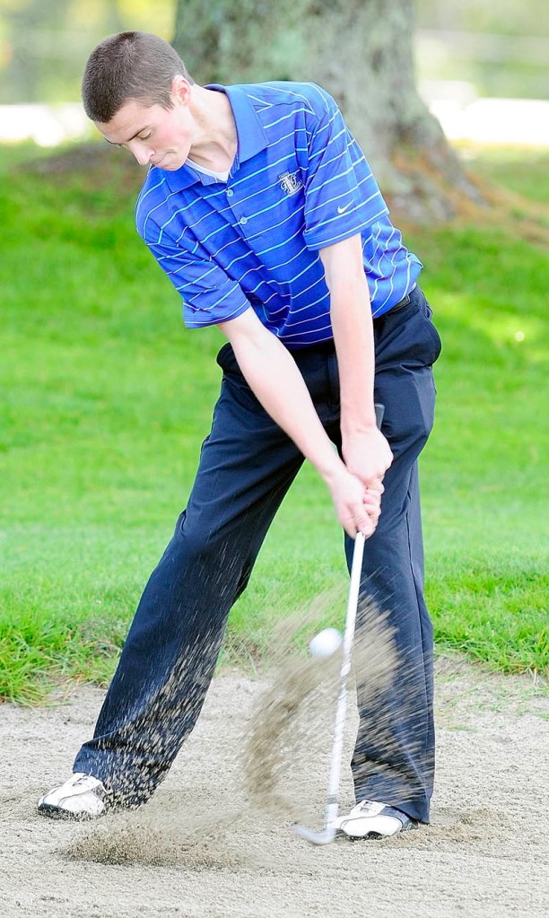 Lawrence's Zachary Hale hits out of a bunker on 18th hole of Arrowhead during the Kennebec Valley Athletic Conference qualifier tournament on Tuesday at Natanis Golf Club in Vassalboro.