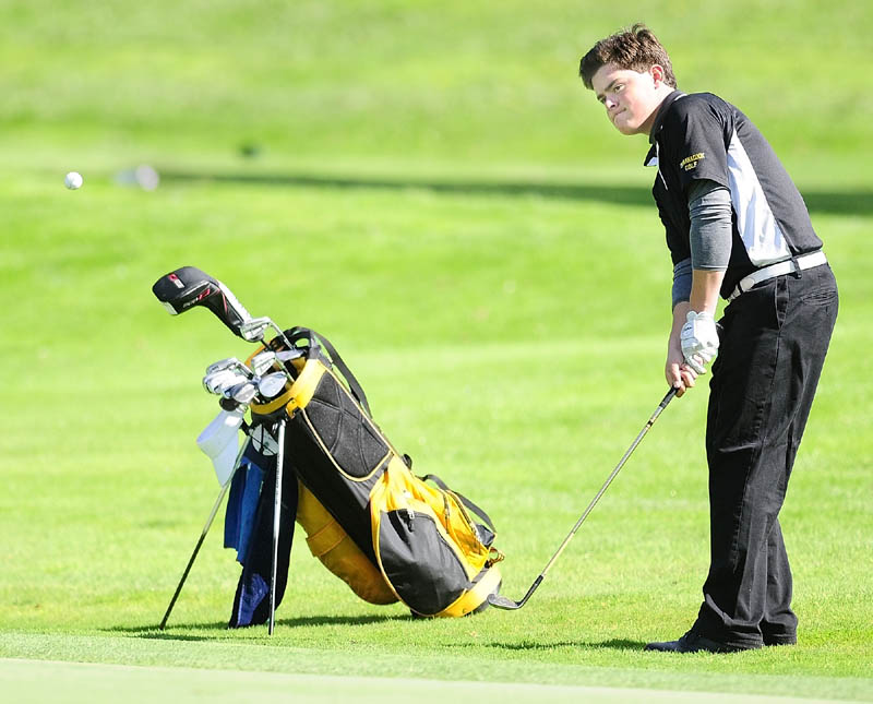 SOLID PLAY: Maranacook’s Tucker Whitman chips onto 18th green of the Tomahawk course during the Kennebec Valley Athletic Conference qualifier tournament on Tuesday at Natanis Golf Club in Vassalboro. Maranacook qualified for the team tournament with a 321, while Whitman qualfied for the individual tournament with an 82.