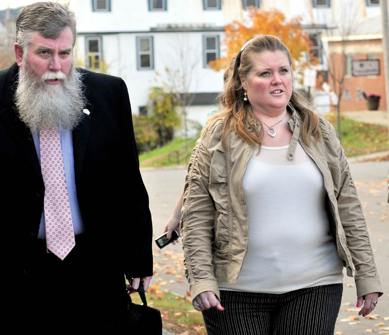 Amanda Huard and attorney John Youney enter Skowhegan District Court on Monday for a hearing for her daughter Kelli Murphy, 11, who has been charged with manslaughter in the death of Brooklyn Foss-Greenaway.