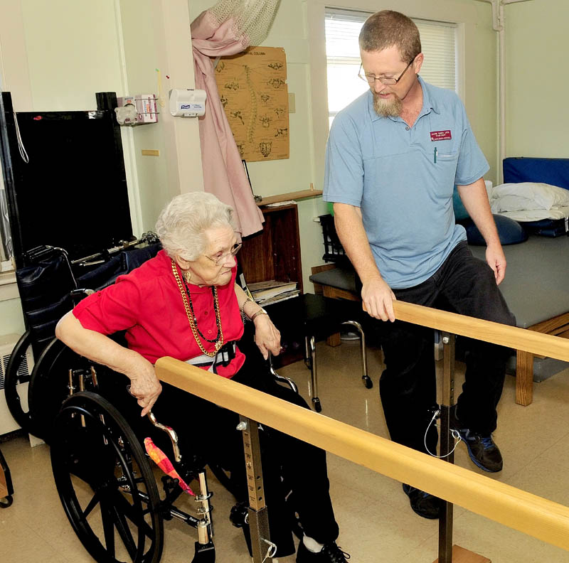 Physical therapist assistant Jason Toner works with a client at the Sanfield Rehabilitation Living Center in Hartland. Toner has received two awards for his work.