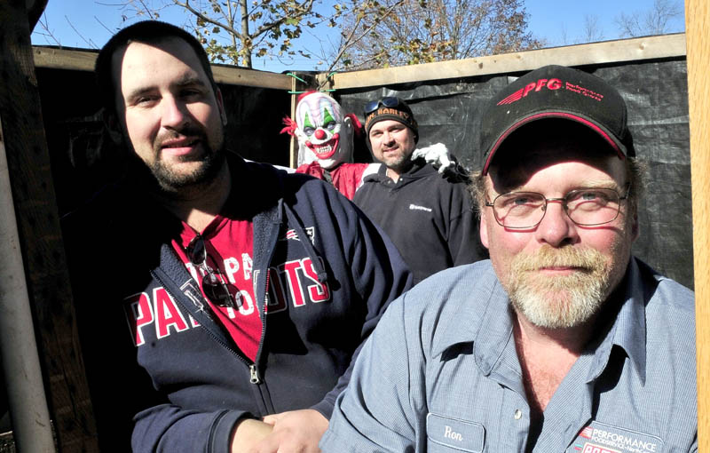SPOOKS: These men and many others have created the "Nightmare on North Main Street" haunted trail in Pittsfield to scare the expected 800 visitors this Halloween. From left are Matt Dunton, a demonic clown, and Patrick and Ron Steeves.
