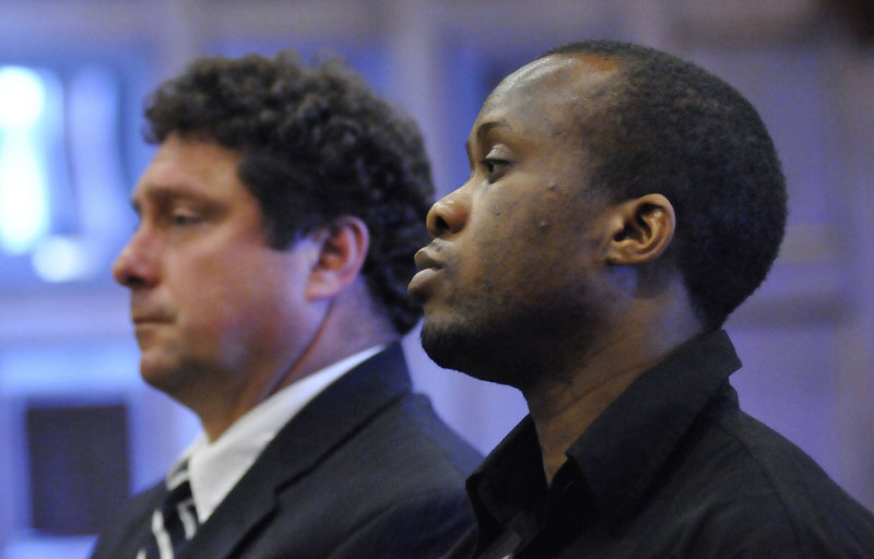 Daudoit Butsitsi listens to the judge as he is found guilty in the shooting death of Serge Mulongo on July, 21, 2011. To his left is Butsitsi's court-appointed lawyer Anthony Sineni.