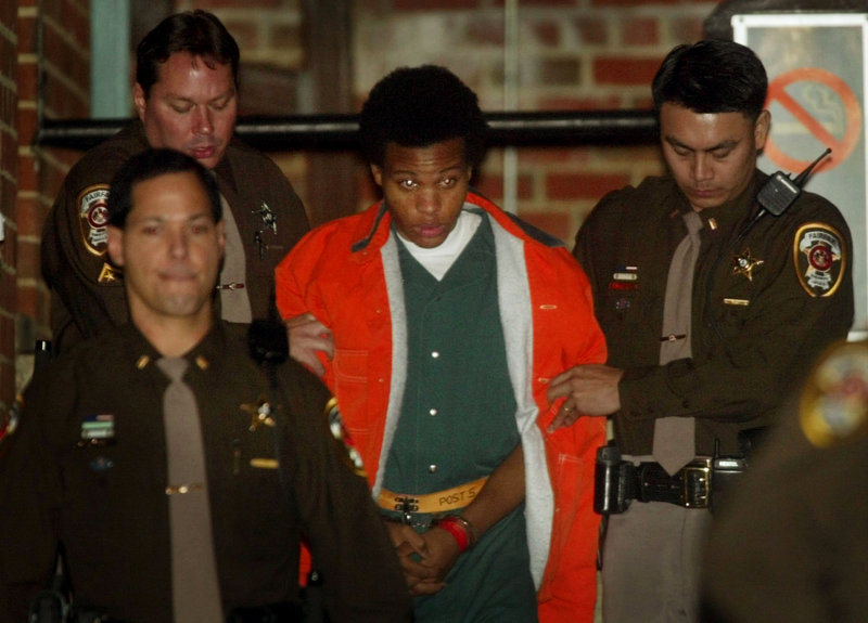 Lee Boyd Malvo is escorted from court in Fairfax, Va., in 2003, after a hearing in connection with the D.C. sniper shootings. Now in prison for life, Malvo urges the survivors of his victims to resist being victimized themselves by dwelling on what Malvo and his partner did.