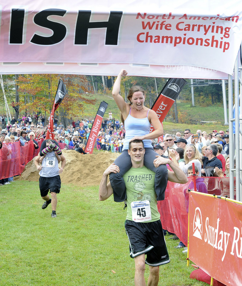 Michael and Jessica Keefe of Effingham, N.H., celebrate their finish.