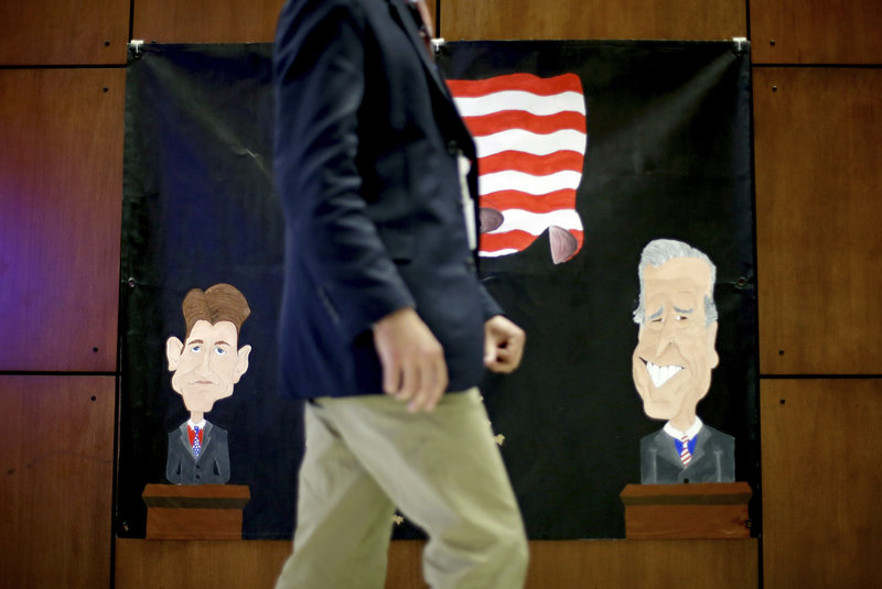 A banner made by middle school students for Thurday's debate at Centre College in Danville, Ky., depicts Republican vice presidential candidate Paul Ryan, left, and Vice President Joe Biden.