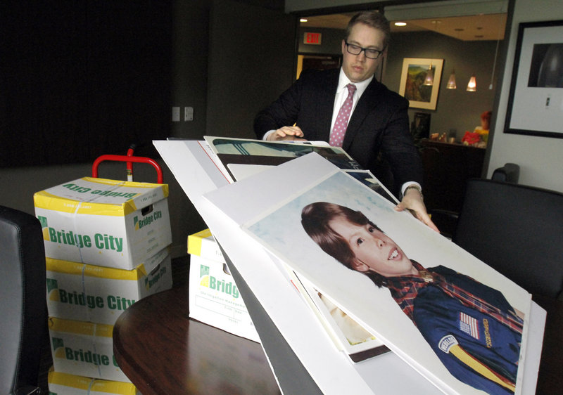 Attorney Peter Janci arranges boxes of records from the Boy Scouts of America in Portland, Ore., after the Oregon Supreme Court in June approved the release of nearly 20,000 pages of so-called perversion files compiled by the Boy Scouts of America. More records are to be released Thursday.