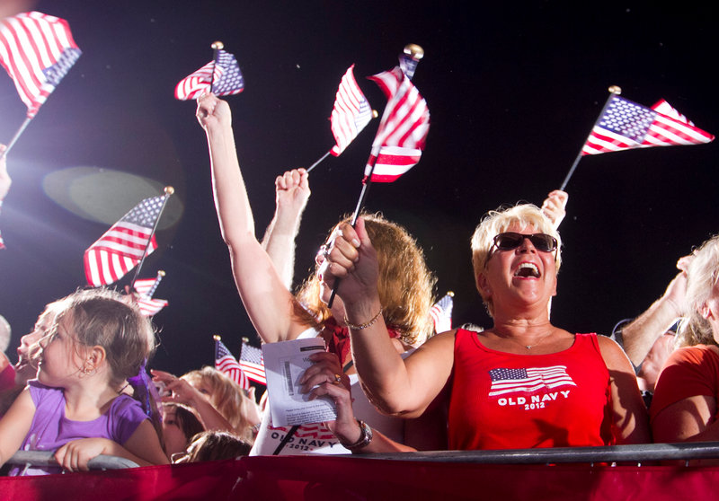 Supporters Judy Groth, center, and Debbie Kohl, right, cheer for Rep. Paul Ryan, R-Wis., the Republican vice-presidential candidate, Thursday in south Fort Myers, Fla.
