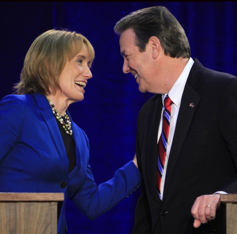New Hampshire gubernatorial candidates Maggie Hassan, who is a Democrat, and Ovide Lamontagne meet at a debate in Henniker. Unions have launched ads against Lamontagne, a Republican, who has said he would sign a right-to-work bill.