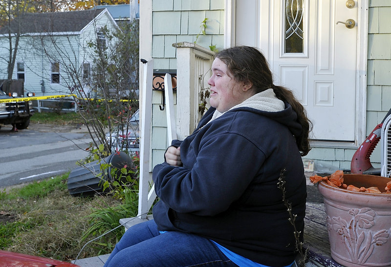 Caleigh Mills, who lives across the street from the Old Orchard Beach fire, weeps after hearing of Patricia Noel's death.