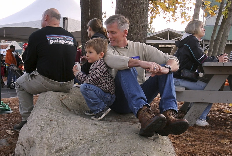 Charlie Summers takes a break with his son Thomas at the Camp Sunshine Pumpkin Festival at L.L. Bean in Freeport. They also did some pumpkin bowling and imaginary fishing.
