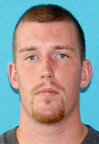 This image provided by the Bangor Police Department shows Nicholas Sexton, 31, of Warwick, R.I. According to police officials, Sexton, 31, is one of two men wanted in connection with the slayings of three people in Maine whose bodies were found in a burning car.