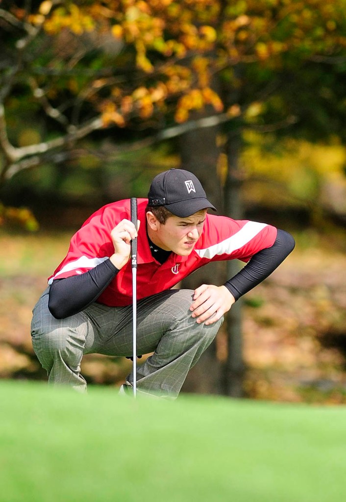 Cony's Zach Gagne lines up a putt during state class A team golf championships on Saturday morning at Natanis Golf Club in Vassalboro.