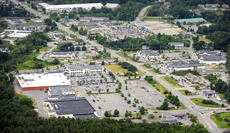 An aerial view of the Falmouth business district along Route 1. A new zoning law limits the size of ground-floor businesses in the retail zone between Bucknam Road and Route 88, which is currently home to a Walmart, a Shaw's supermarket, and a massive shopping complex that is dotted by vacancies.