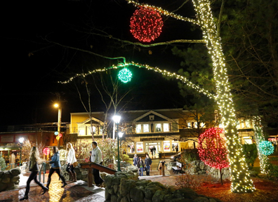 Shoppers roam through the LL Bean campus on Friday after many of the stores in Freeport opened for business at midnight.
