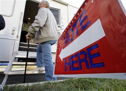 A man waits his turn to vote at a Mobile Voting Precinct van Monday in Burlington, N.J. The Associated Press photo