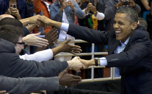 President Barack Obama greets people as he arrives at a campaign event at the Fifth Third Arena on the University of Cincinnati campus, Sunday, Nov. 4, 2012, in Cincinnati. (AP Photo/Carolyn Kaster)