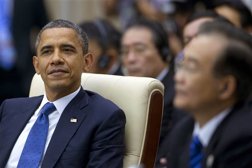 U.S. President Barack Obama, left, attends the East Asian Summit Plenary Session at the Peace Palace in Phnom Penh, Cambodia, Tuesday, Nov. 20, 2012. Seated right is Chinese Premier Wen Jiabao. (AP Photo/Carolyn Kaster)