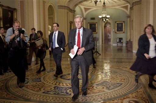 Senator-elect Angus King, I-Maine, walks to a news conference where he announced that he will caucus with the Democrats in the 113th Congress on Capitol Hill in Washington on Wednesday, Nov. 14, 2012.(AP Photo/Harry Hamburg)