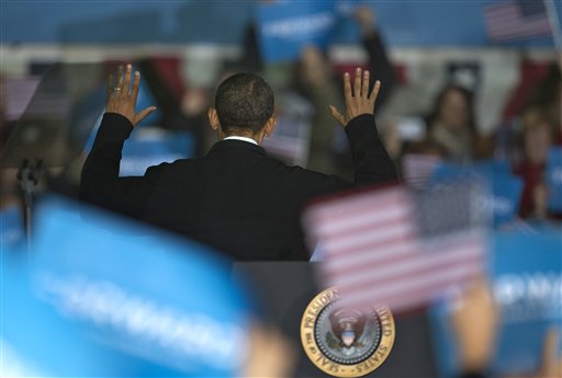 President Barack Obama turns to acknowledge supporters behind him after speaking at a campaign event at the Franklin County Fairgrounds, Friday, Nov. 2, 2012, in Hilliard, Ohio, before heading to another campaign stop in in Springfield, Ohio. (AP Photo/Carolyn Kaster)