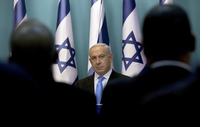 Israeli Prime Minister Benjamin Netanyahu looks on during joint statements together with Israel's Defense Minister Ehud Barak and Israeli Foreign Minister Avigdor Lieberman, not seen, at the Prime Minister's office in Jerusalem, Wednesday, Nov. 21, 2012. Israel and the Hamas militant group agreed to a cease-fire Wednesday to end eight days of the fiercest fighting in nearly four years, promising to halt attacks on each other and ease an Israeli blockade constricting the Gaza Strip. (AP Photo/Sebastian Scheiner)